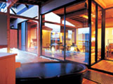 A guestroom with a private open-air hot spring bath attached